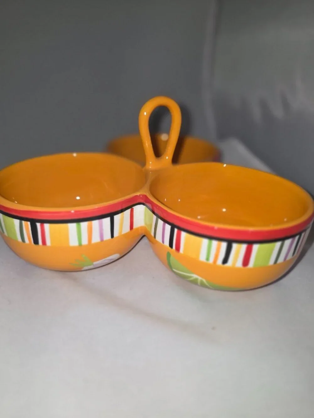 A Crate & Barrel Mambo Margarita triple-bowl ceramic dip server.
